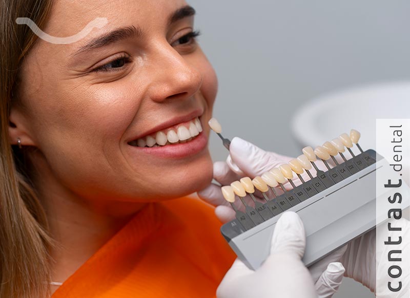 Choosing the color of new artificial teeth